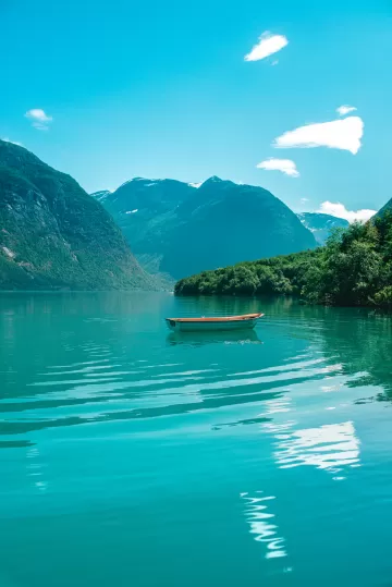 boat mountains lake